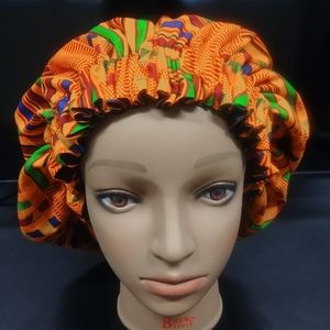 Kente 100% cotton fabric with satin interior. Size